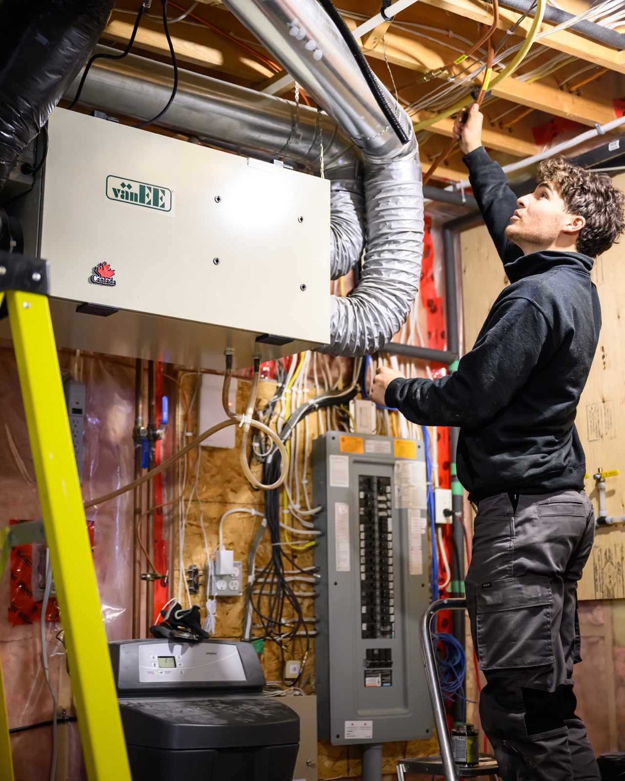 Cornerstone HVAC technician inspecting furnace ductwork